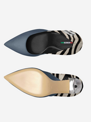 Two shoes with zebra print and metallic accents on a white background