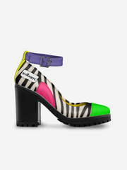 Multicolored shoe with zebra pattern and colorful sole on a white background