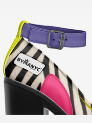 Zebra print shoe with pink interior and purple belt, By Many brand visible