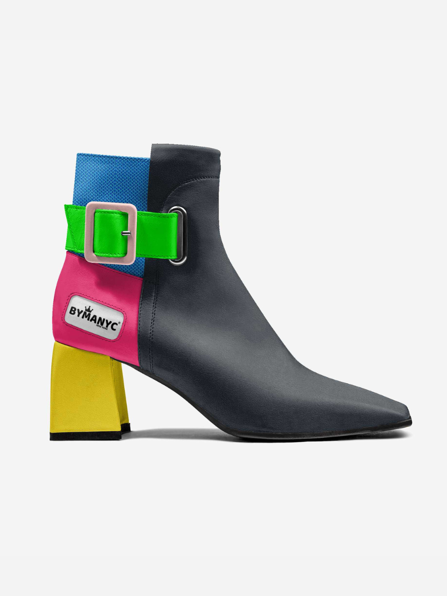 Black ankle boot with colorful strap featuring the brand 'BYMANYC' on a white background
