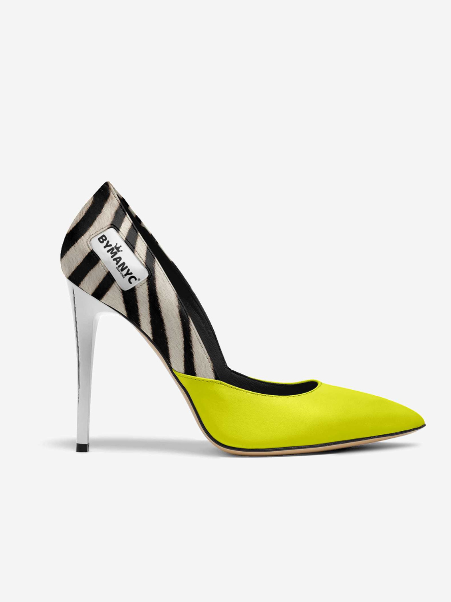 Neon green high-heeled shoe with zebra pattern heel on a white background