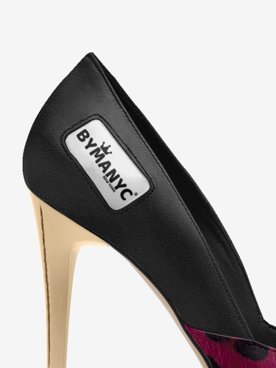 Black high-heeled shoe with 'BY MANYC' label on a white background