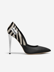 Black high-heeled shoe with zebra pattern strap on a white background