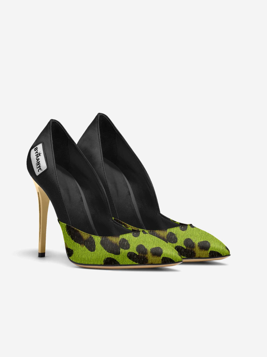 Green high-heeled shoes with black leopard print pattern on a white background