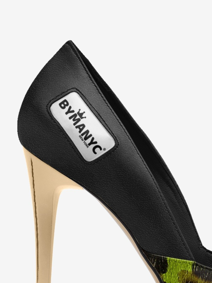 Black high-heeled shoe with 'BY MANYC' label on a white background