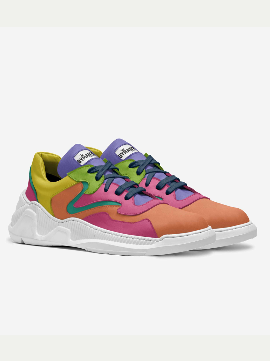 Colorful sneakers with a white sole on a light gray background