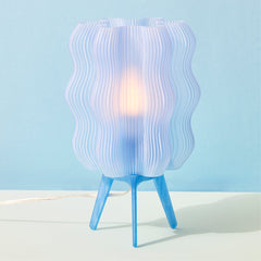 Table lamp with wavy design on a blue background