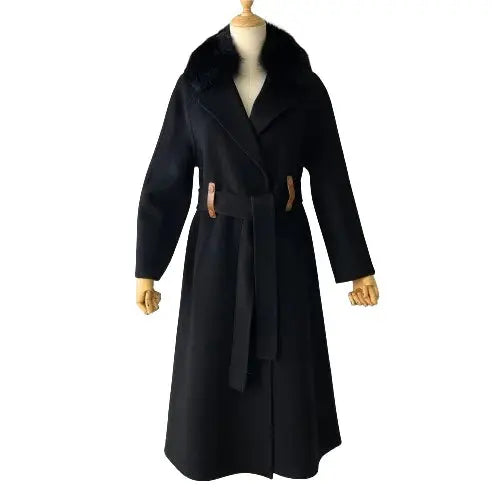 Black coat with fur collar on a mannequin against a white background