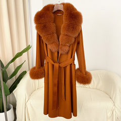 Brown coat with fur trim hanging on a chair against a white curtain background