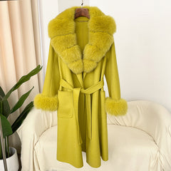 Yellow coat with fur collar on a chair against a white wall