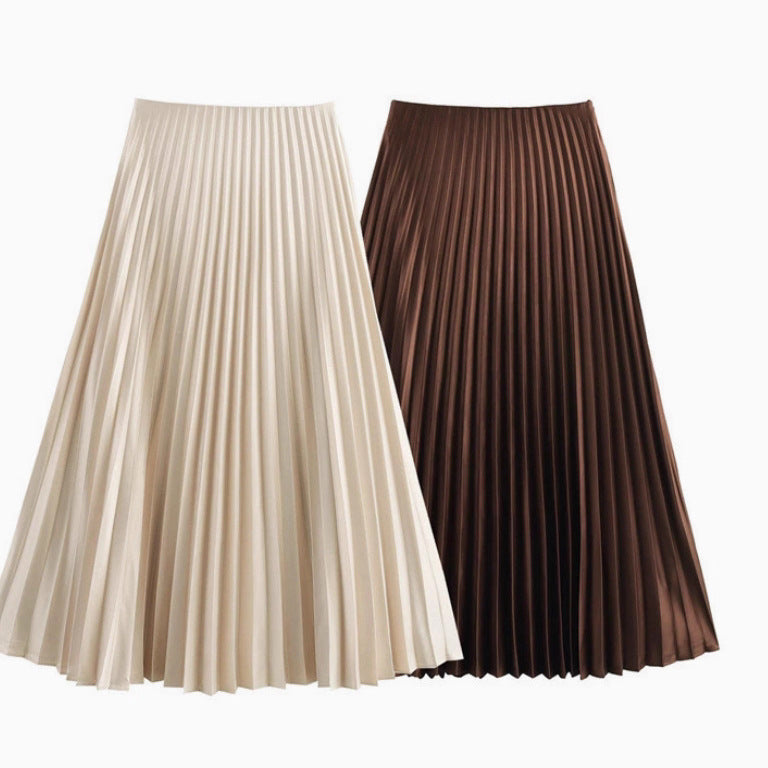 Two pleated skirts, one beige and one brown, on a white background.