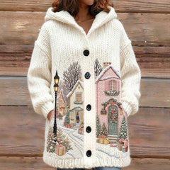 Knitted cardigan with winter scene design on a wooden background