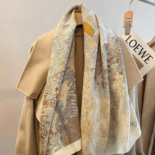Beige coat with a patterned scarf draped over it, hanging on a LOEWE branded hanger.
