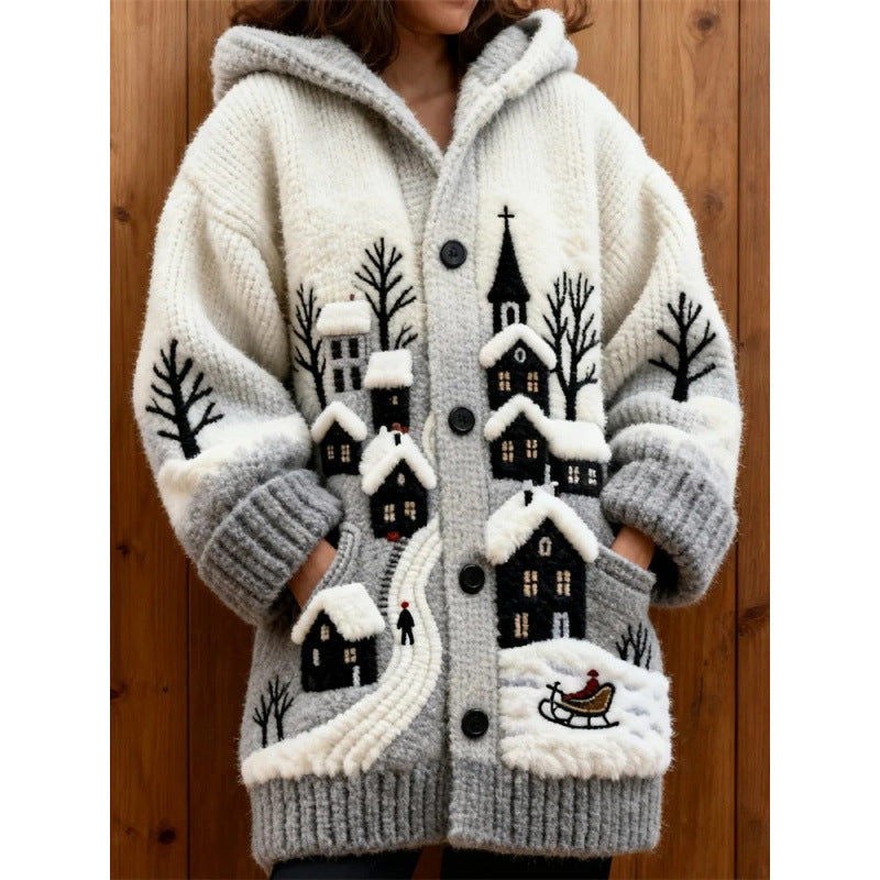 Knitted cardigan with winter scene design on a wooden background