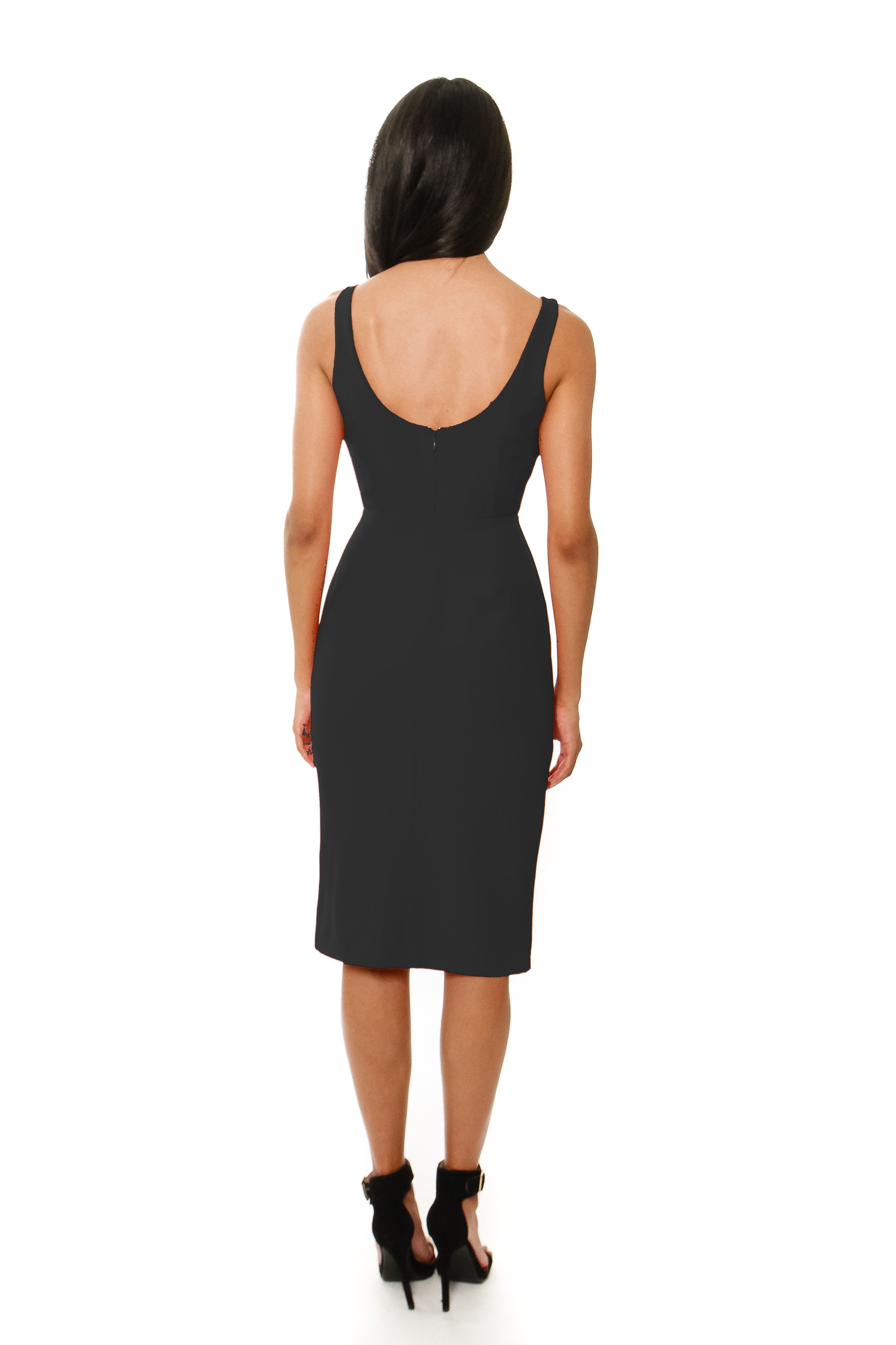 Woman wearing a black dress on a white background