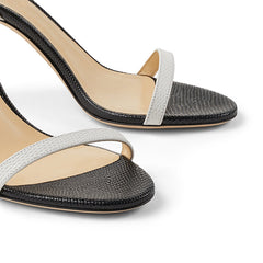 Black and gray high-heeled sandals on a white background