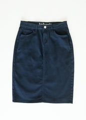 Navy blue denim skirt with 'inhabit' branding on a white background