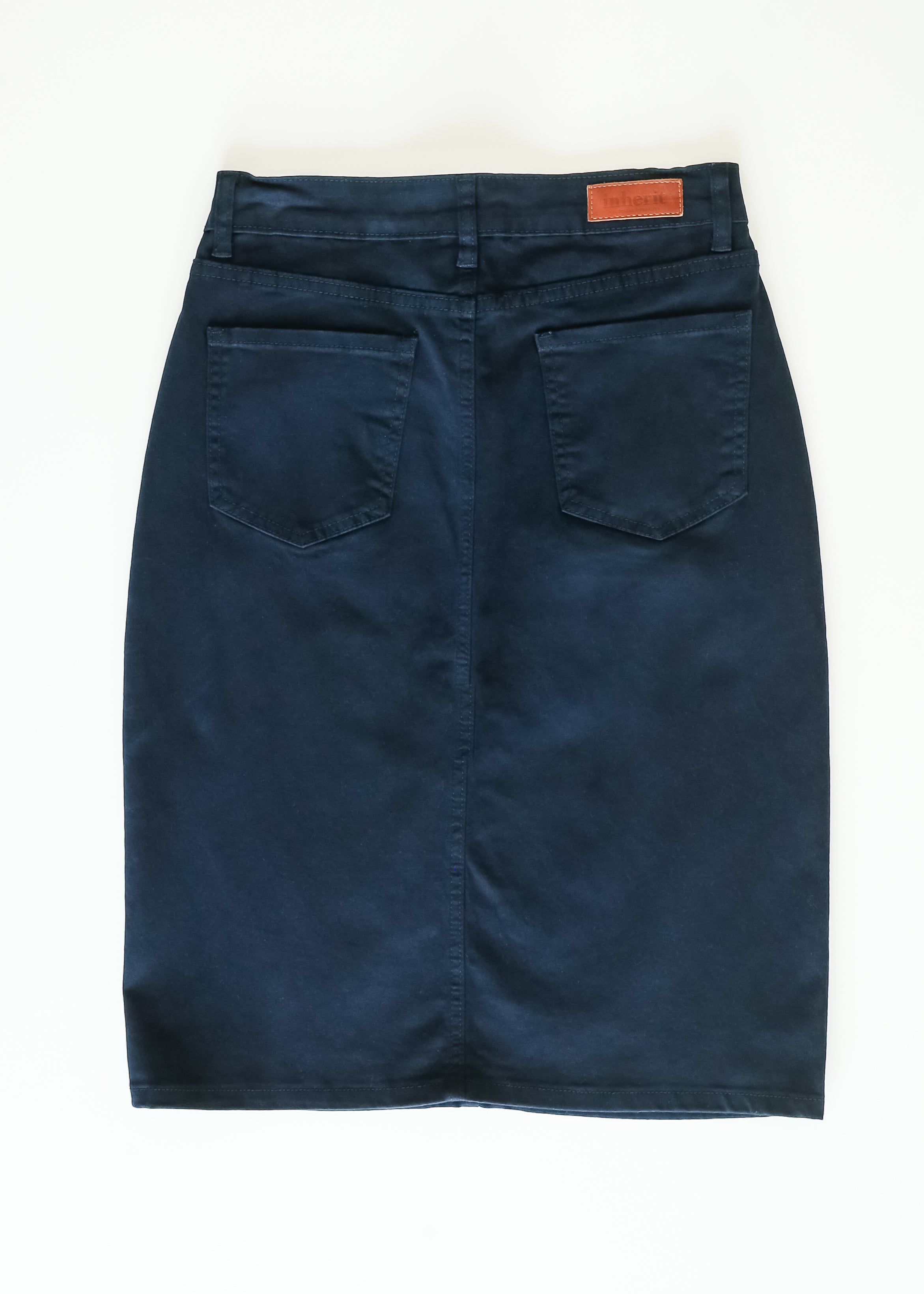 Blue denim skirt on a white background