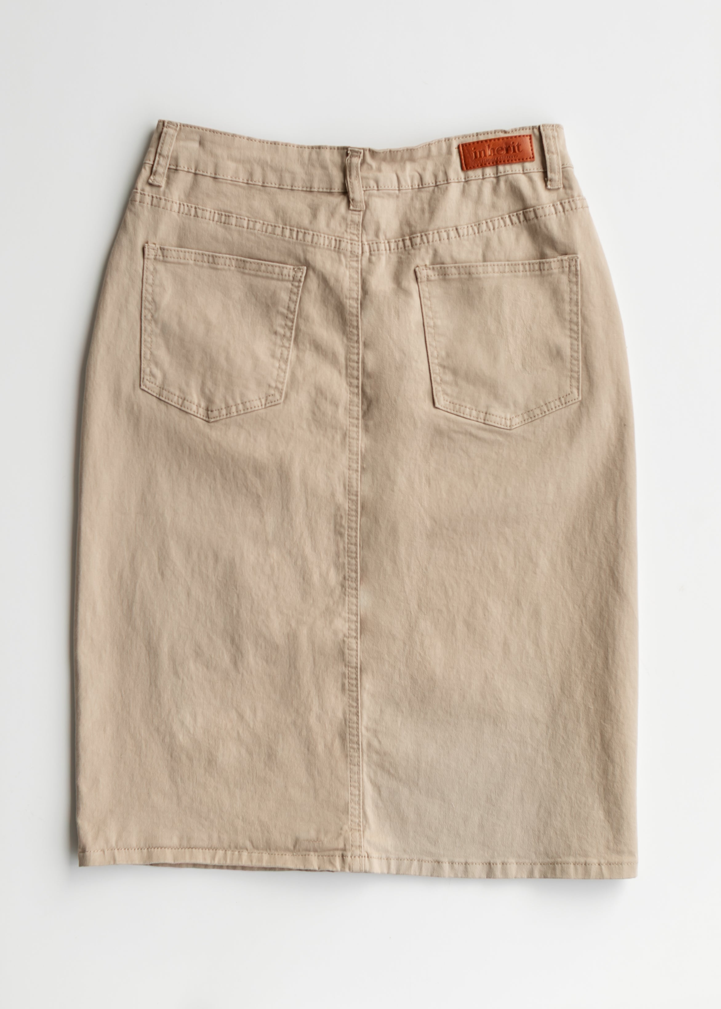 Beige skirt with two front pockets on a white background