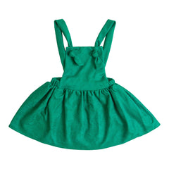 Green dress with suspenders on a white background