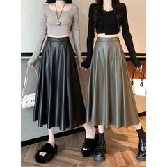 Women's faux leather midi skirt styling
